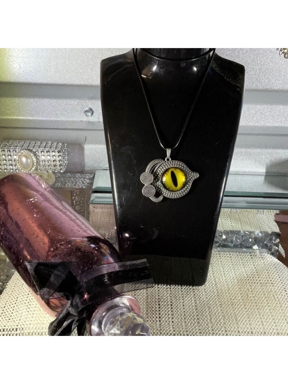 YELLOW EVIL EYE PENDENT ON AN 18” TO 20” BLACK LEATHER NECKLACE